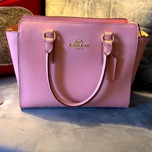 Small used coach light pink handbag. Less than 2 years old